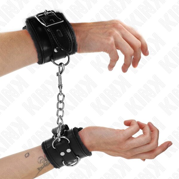imagen KINK - MUÑEQUERAS FORRADAS NEGRO CON CORREA NEGRO AJUSTABLE 20-29 CM X 5.5 CM